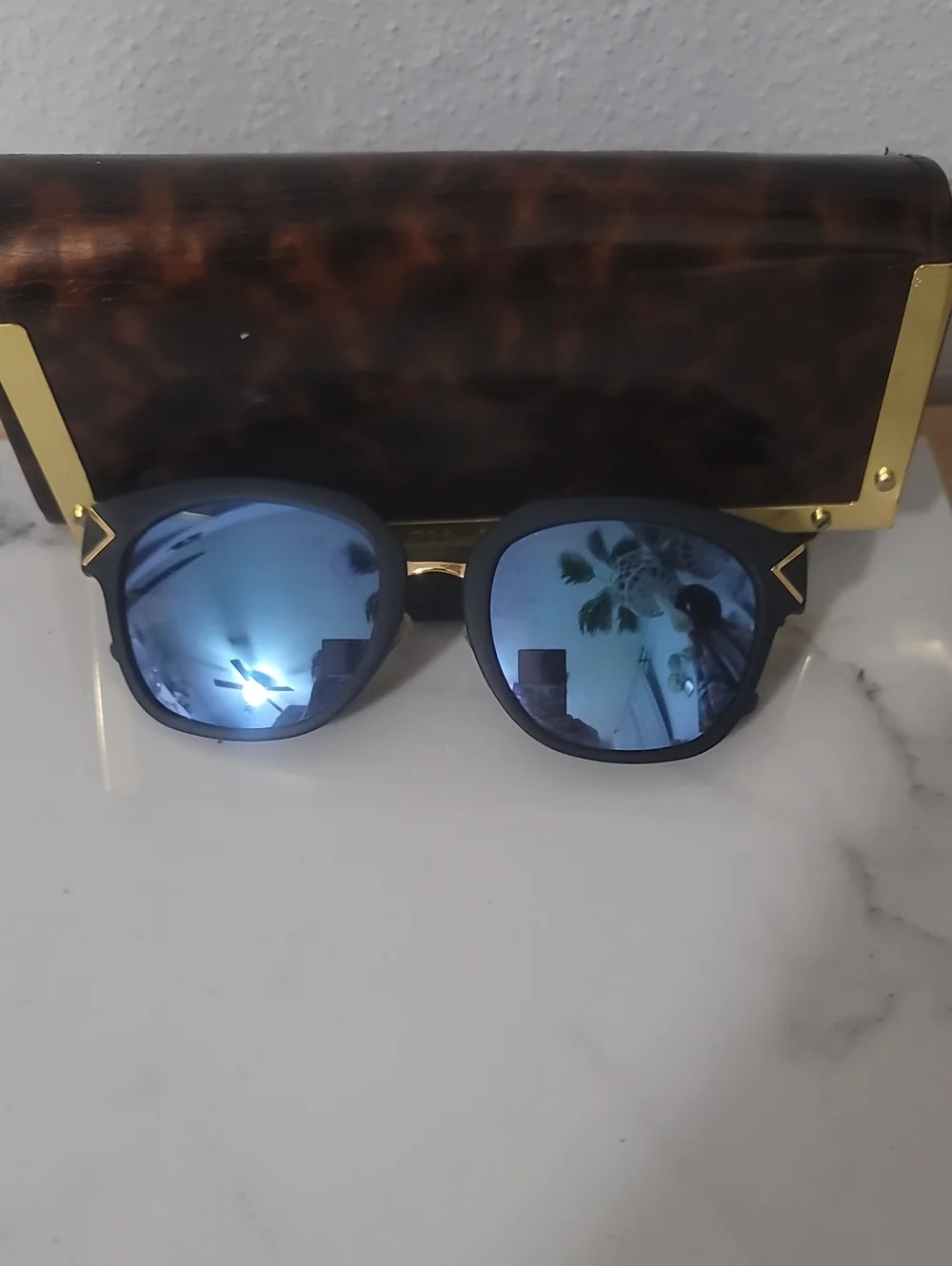 Tory Burch Black Frame Sunglasses with Blue Mirrored Lenses